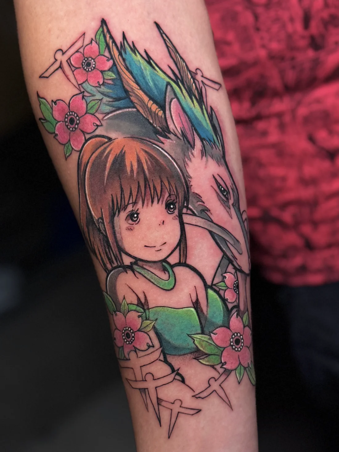Tatuagem colorida de Sen e Haku de A Viagem de Chihiro feita pela Jess Zanatta
